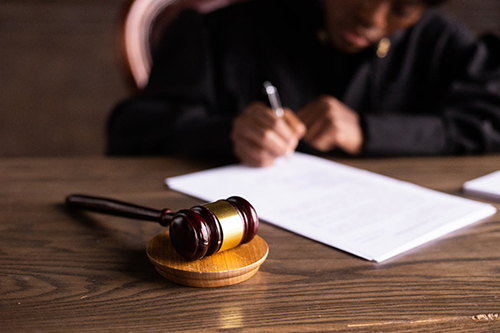 A Judge Signing Papers