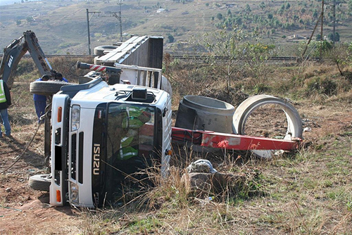 construction truck rolled over on its side